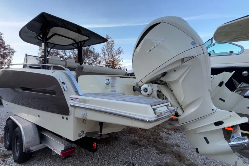Slide: The Image of 2024 Invictus GT280S boat with outboard motor on trailer, sleek design. - 3