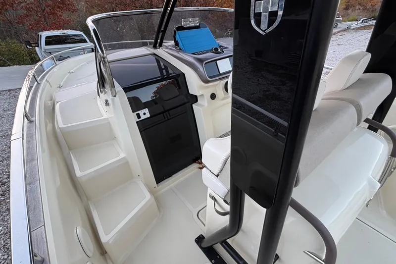 Slide: The Image of 2024 Invictus GT280S boat interior with helm, seating, and modern dashboard. - 5