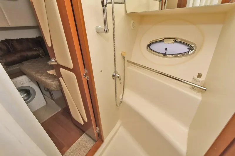 Slide: The Image of 2009 Silverton 52 Ovation yacht interior with shower and cozy cabin area. - 21