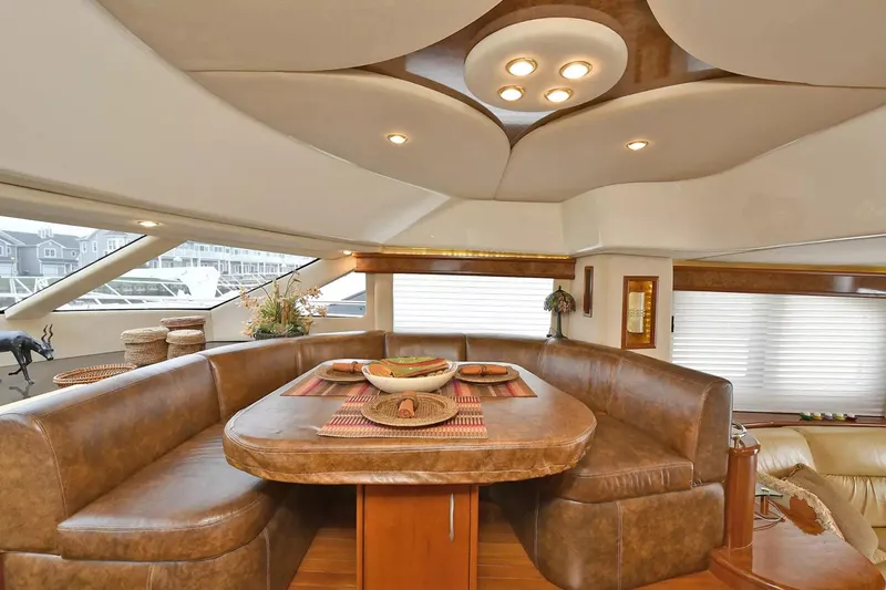 Slide: The Image of Luxurious interior of 2009 Silverton 52 Ovation yacht with elegant dining area and modern lighting. - 8
