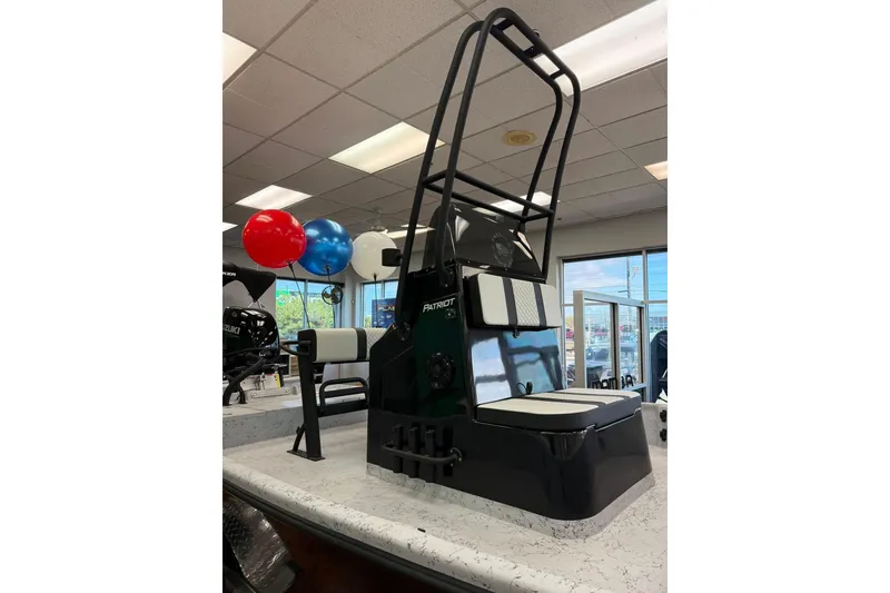 Slide: The Image of 2026 Freedom Boats 19 PATRIOT on trailer, parked outdoors with cloudy sky. - 15