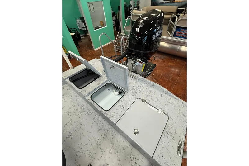 Slide: The Image of Rear view of 2026 Freedom Boats 19 PATRIOT with motor and trailer. - 8