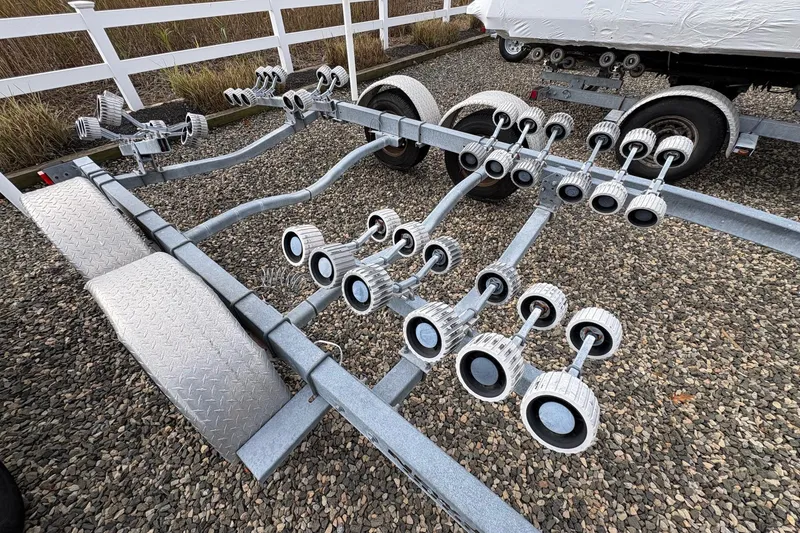 Slide: The Image of Boat trailer for 2015 Sea Hunt Ultra 234 on gravel surface. - 17