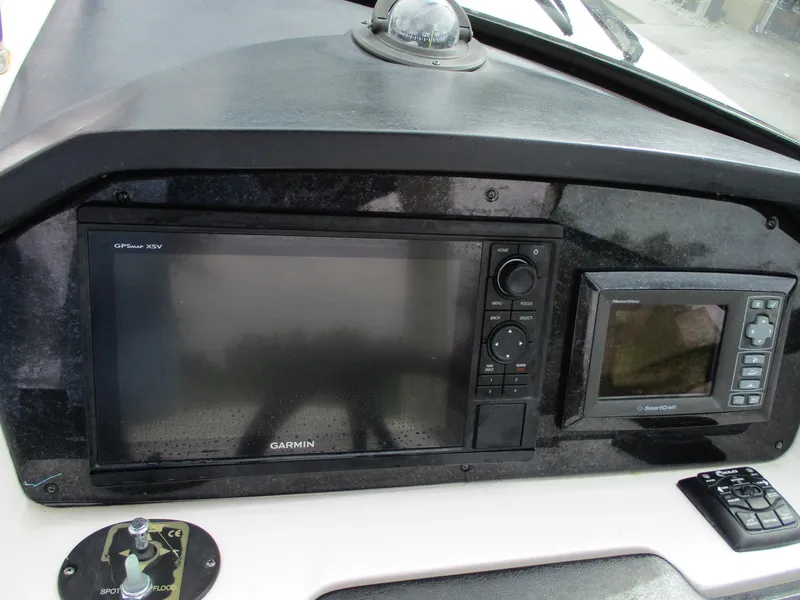 Slide: The Image of Dashboard of a 2010 Sea Ray 300 SLX boat with Garmin navigation system. - 4