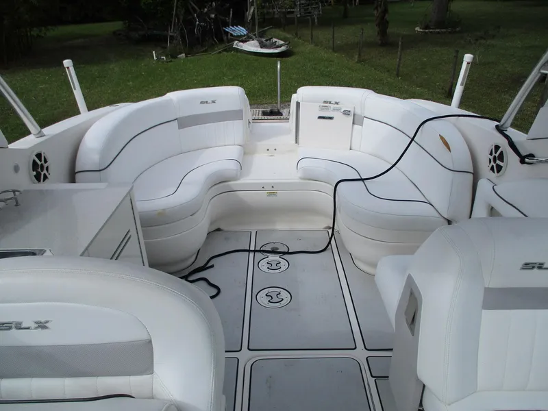 Slide: The Image of 2010 Sea Ray 300 SLX boat interior with white seating and spacious layout. - 7