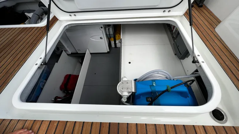 Slide: The Image of Engine room of 2020 Beneteau Swift Trawler 44 with Cummins Onan generator. - 17