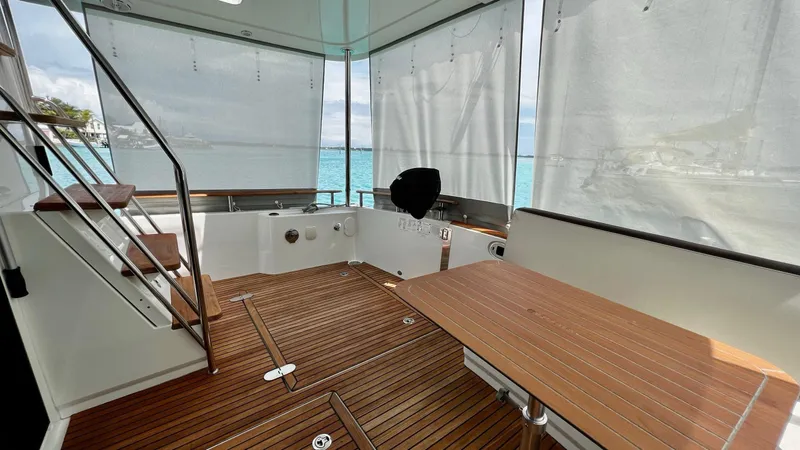 Slide: The Image of 2020 Beneteau Swift Trawler 44, rear deck view with stairs and sliding door. - 30