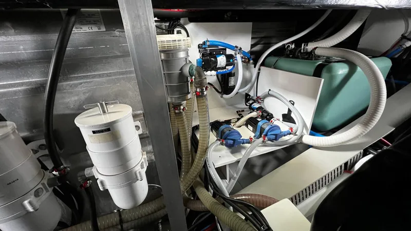 Slide: The Image of Engine room of 2020 Beneteau Swift Trawler 44 with batteries and mechanical components. - 35