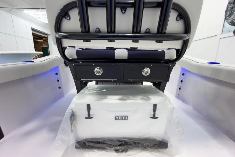 Slide: The Image of 2026 Tidewater 232 CC Adventure boat interior with Yeti cooler and storage drawers. - 14