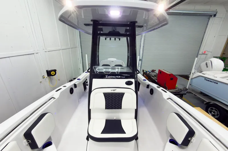 Slide: The Image of 2026 Tidewater 232 CC Adventure boat interior with modern seating and console design. - 31