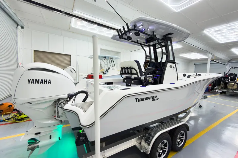 Slide: The Image of 2026 Tidewater 232 CC Adventure boat with Yamaha engine in a showroom. - 36
