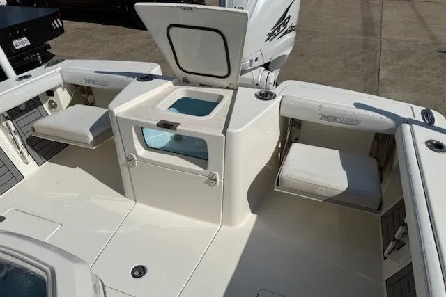 Slide: The Image of 2021 Pathfinder 2700 Open boat deck with storage compartments and outboard motor. - 11