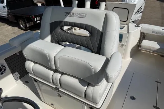 Slide: The Image of 2021 Pathfinder 2700 Open boat interior with seating and storage compartments. - 12