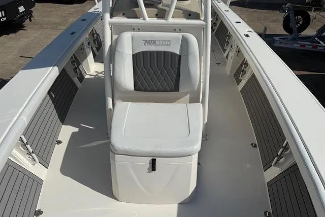 Slide: The Image of 2021 Pathfinder 2700 Open boat interior with storage compartments and seating. - 17