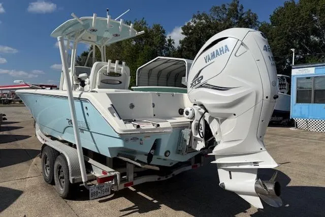 Slide: The Image of 2021 Pathfinder 2700 Open boat on trailer, parked outdoors under blue sky. - 4