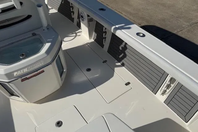 Slide: The Image of 2021 Pathfinder 2700 Open boat deck with storage compartments and seating area. - 9
