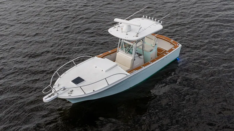 Slide: The Image of 2009 Bimini 24 Center Console boat on water, aerial view. - 10