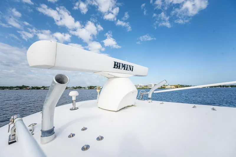 Slide: The Image of Bimini 24 Center Console boat, 2009 model, on water under blue sky. - 24