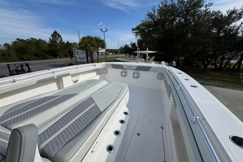 Slide: The Image of 2023 Invincible 46 Catamaran interior with cushioned seating and sleek design. - 24