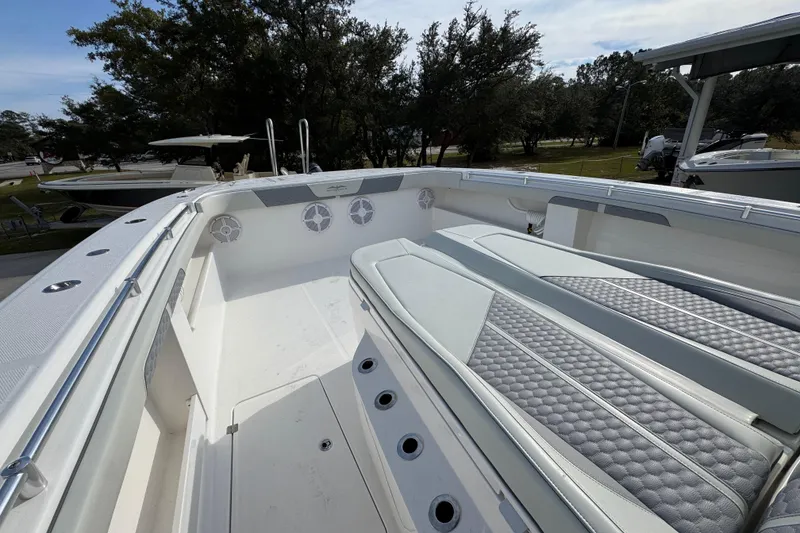 Slide: The Image of 2023 Invincible 46 Catamaran interior with cushioned seating and sleek design. - 25