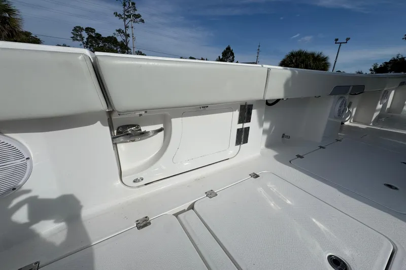 Slide: The Image of 2023 Invincible 46 Catamaran deck with storage compartments and sleek design. - 41