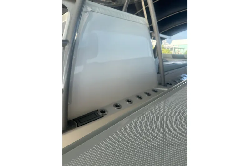 Slide: The Image of 2023 Invincible 46 Catamaran on trailer under clear sky. - 9