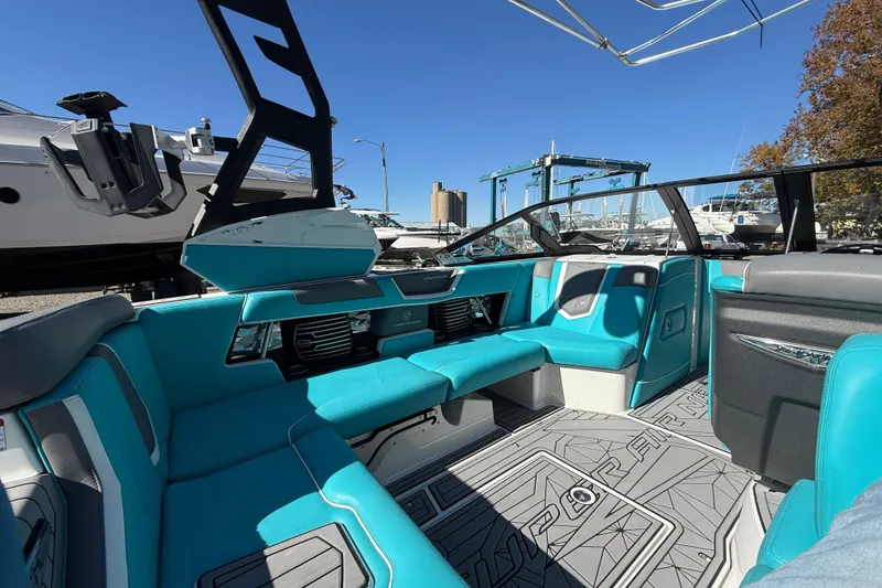 Slide: The Image of 2019 Nautique Super Air Nautique G21 interior with turquoise seating and modern design. - 12