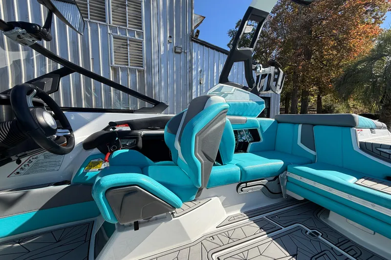 Slide: The Image of 2019 Nautique Super Air Nautique G21 interior with turquoise seating and modern design. - 13