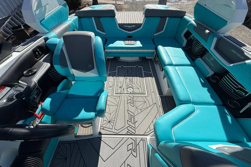 Slide: The Image of 2019 Nautique Super Air Nautique G21 interior with turquoise seating and modern design. - 14