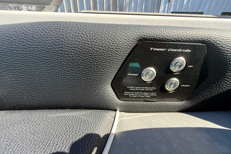 Slide: The Image of 2019 Nautique Super Air Nautique G21 tower controls on black leather panel. - 17
