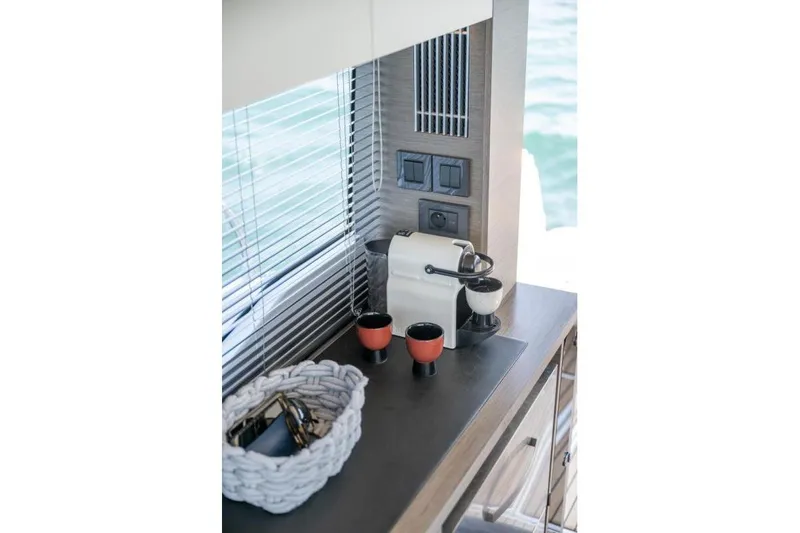 Slide: The Image of Modern kitchen area in 2026 Jeanneau NC 1295 Coupe yacht with coffee maker. - 26