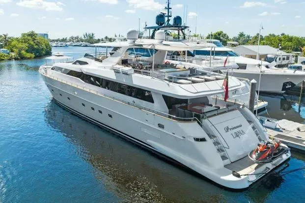 Slide: The Image of Luxury 2006 Tecnomar 35 Nadara yacht docked in serene marina setting. - 1