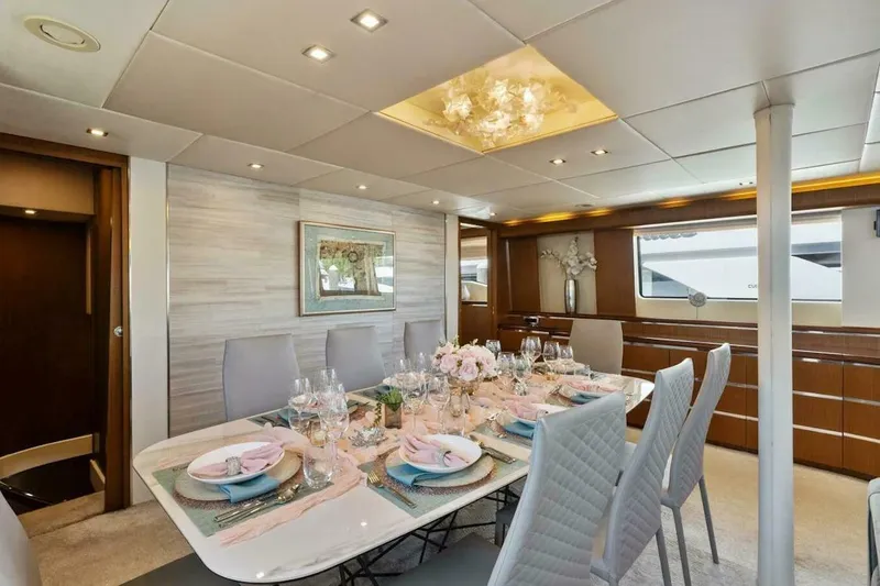 Slide: The Image of Luxurious dining area on 2006 Tecnomar 35 Nadara yacht, elegantly set table, modern decor. - 10
