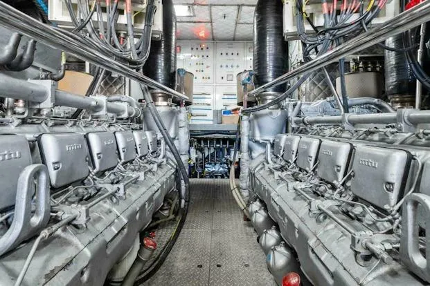 Slide: The Image of Engine room of 2006 Tecnomar 35 Nadara yacht, showcasing dual engines and control panels. - 23