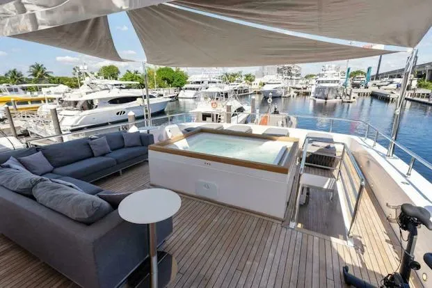 Slide: The Image of Luxurious Tecnomar 35 Nadara yacht deck with hot tub and seating, docked at marina, 2006 model. - 5