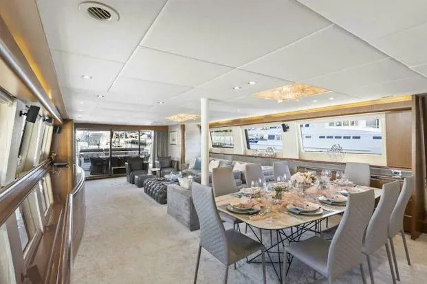 Slide: The Image of Luxurious interior of 2006 Tecnomar 35 Nadara yacht with elegant dining area. - 9