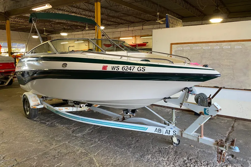 The Image of 2004 Crownline 192 BR boat on trailer in indoor storage facility. - 0
