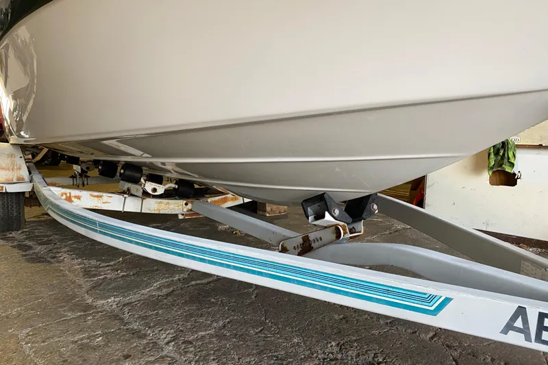 Slide: The Image of 2004 Crownline 192 BR boat on trailer, showing hull and support structure. - 4