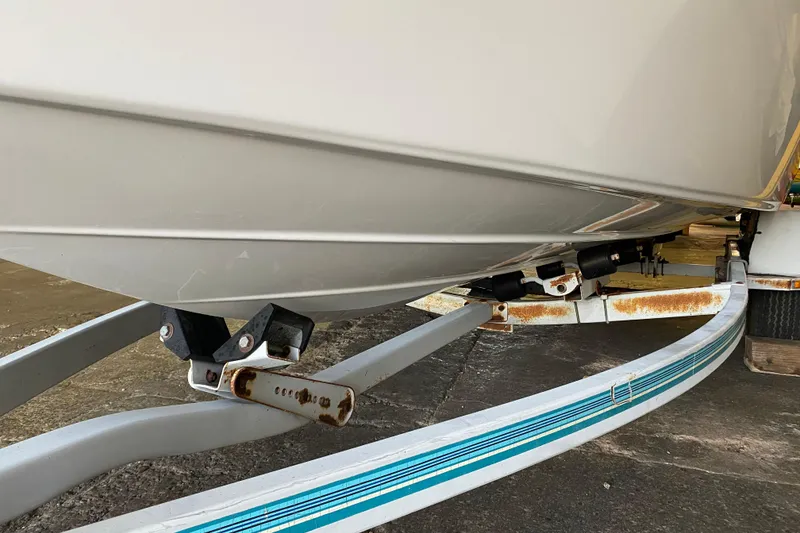 Slide: The Image of 2004 Crownline 192 BR boat on trailer, showing hull and support structure. - 5