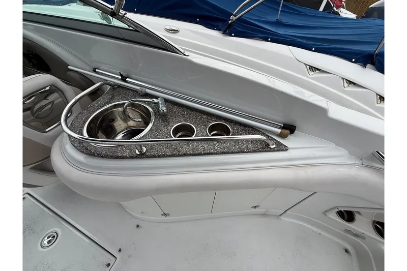 Slide: The Image of 2013 Crownline Eclipse E6 boat interior with sink and cup holders. - 13