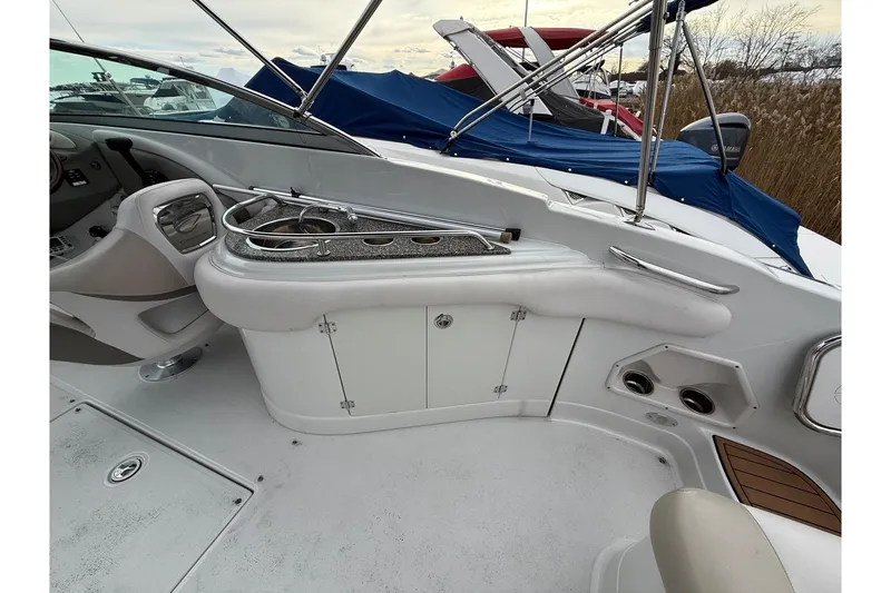 Slide: The Image of 2013 Crownline Eclipse E6 boat interior with seating and storage compartments. - 14