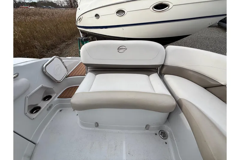 Slide: The Image of 2013 Crownline Eclipse E6 boat interior with white and beige seating. - 15