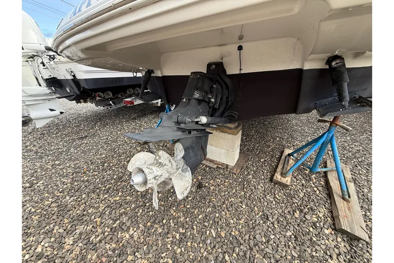 Slide: The Image of 2013 Crownline Eclipse E6 boat on stands, showing propeller and hull details. - 27