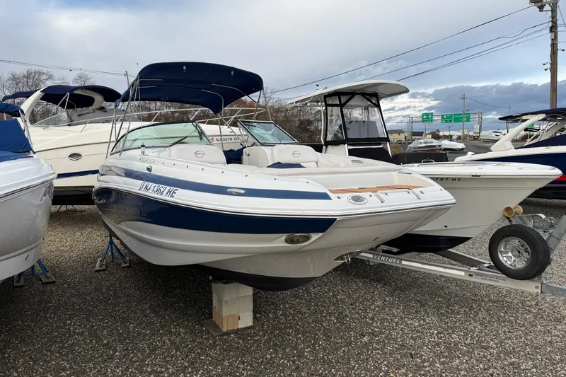Slide: The Image of 2013 Crownline Eclipse E6 boat on display, featuring a blue and white design. - 3