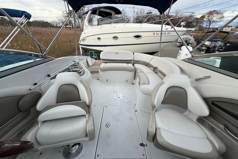 Slide: The Image of 2013 Crownline Eclipse E6 boat interior with white seating and sleek design. - 5