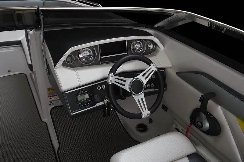 Slide: The Image of 2017 Four Winns HD220 RS boat interior with compact toilet and spotlight. - 12