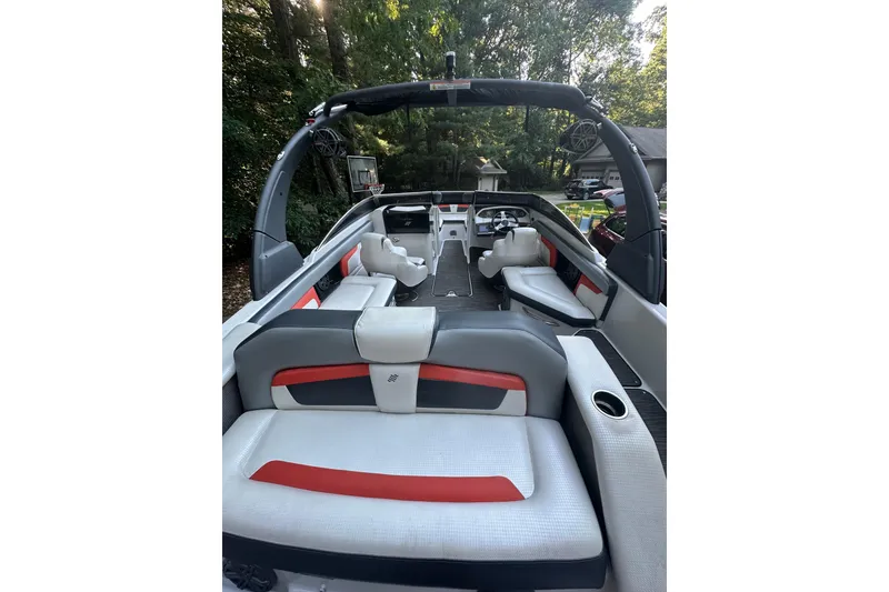 Slide: The Image of 2017 Four Winns HD220 RS boat interior with modern seating and ambient lighting. - 2