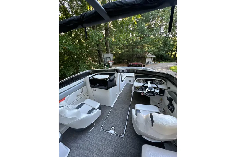 Slide: The Image of 2017 Four Winns HD220 RS boat interior with modern seating and illuminated dashboard. - 4