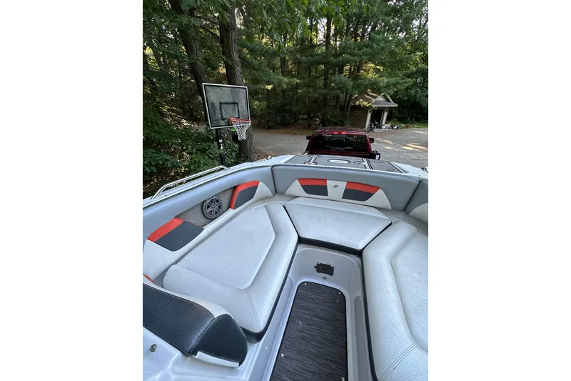 Slide: The Image of 2017 Four Winns HD220 RS boat interior with modern seating and dashboard. - 7