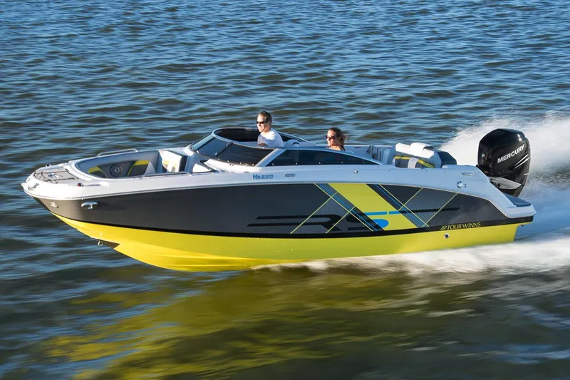 Slide: The Image of 2017 Four Winns HD220 RS boat interior with cushioned seating and ambient lighting. - 8